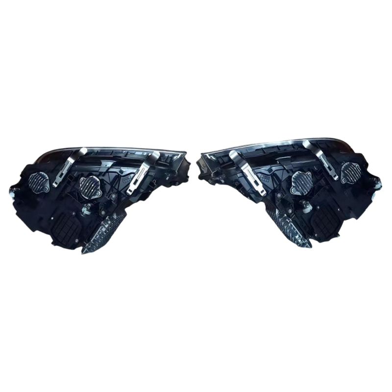 A pair of black automotive headlight assemblies with clear lenses and silver mounting hardware, shown against a solid white background.