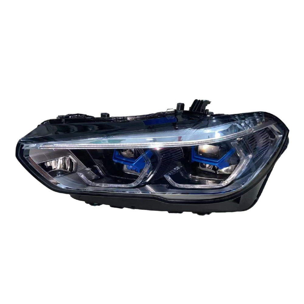 A single automotive headlight assembly shown on a plain white background. The headlight has a clear lens with visible blue accent rings around the projector lenses and a black housing structure.