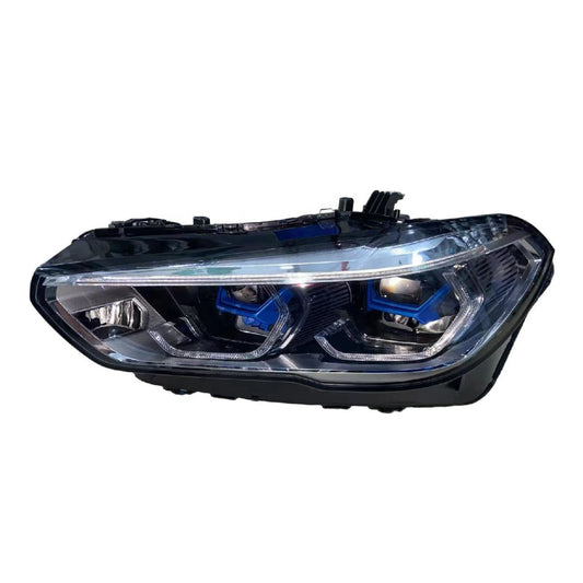 A single automotive headlight assembly shown on a plain white background. The headlight has a clear lens with visible blue accent rings around the projector lenses and a black housing structure.