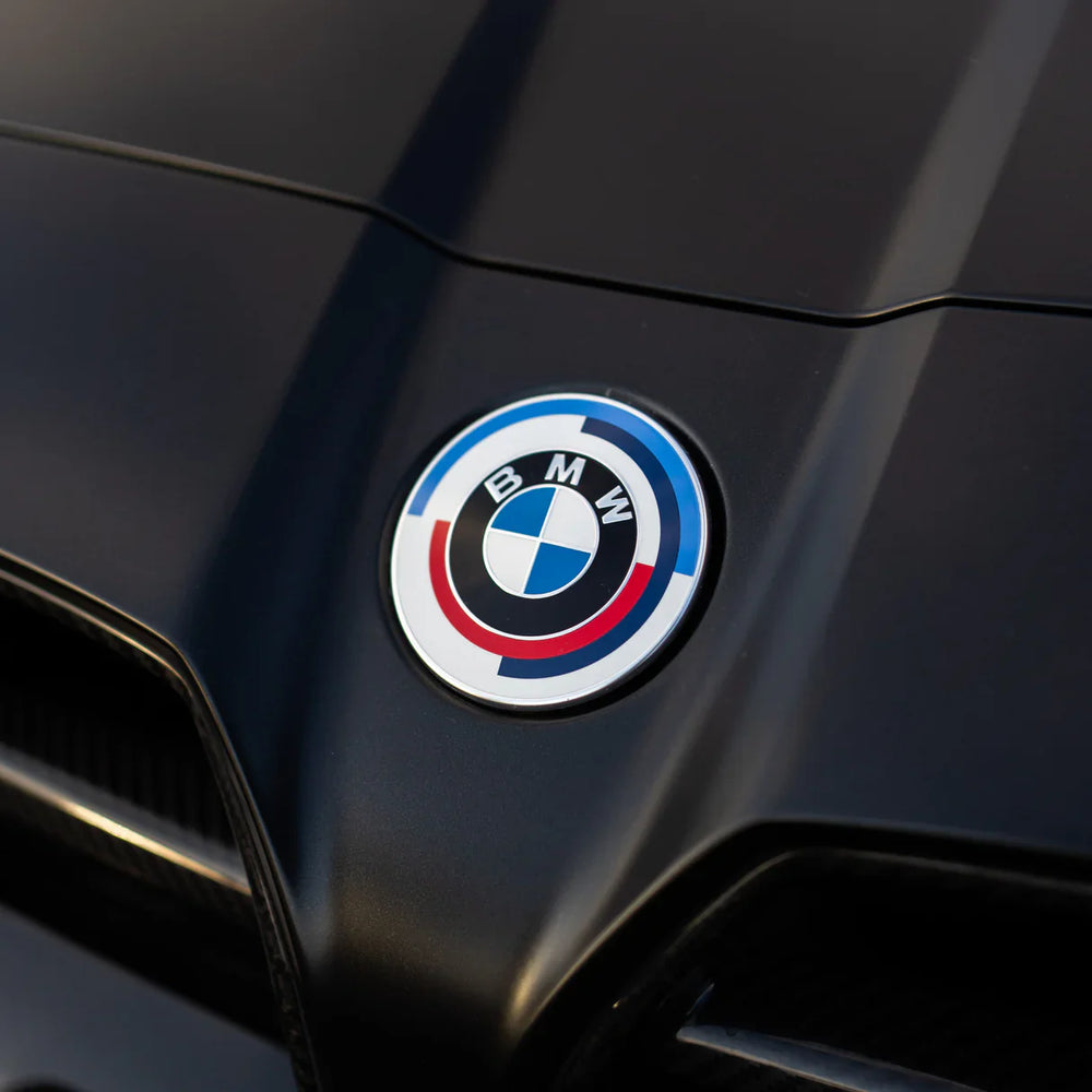 BMW logo on a black car surface