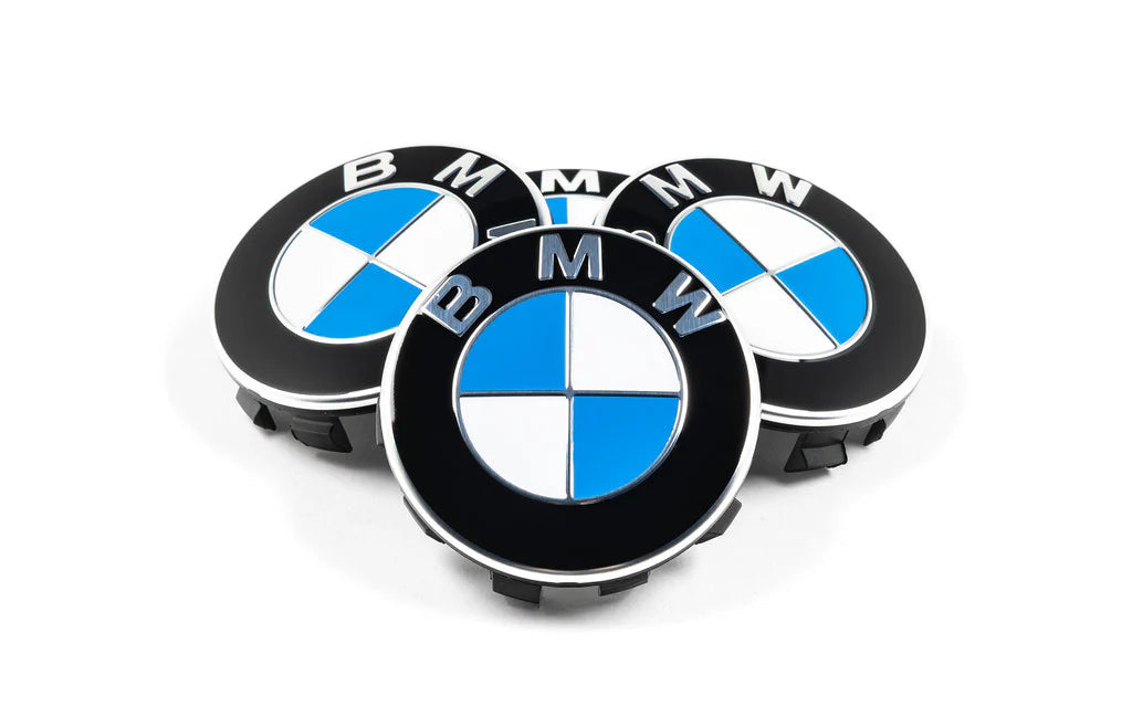 Three BMW emblems on a white background